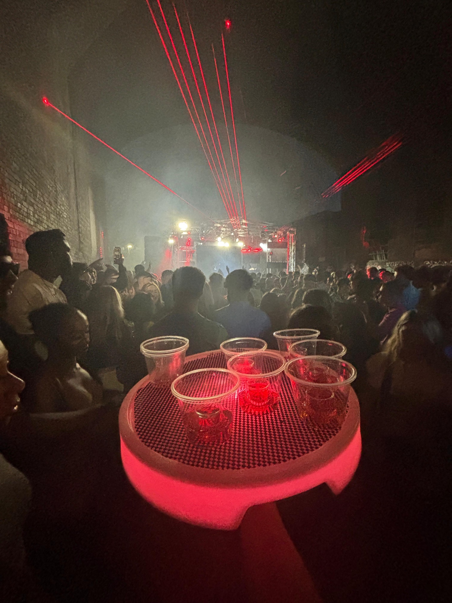 Shot tray with red lasers over the crowd