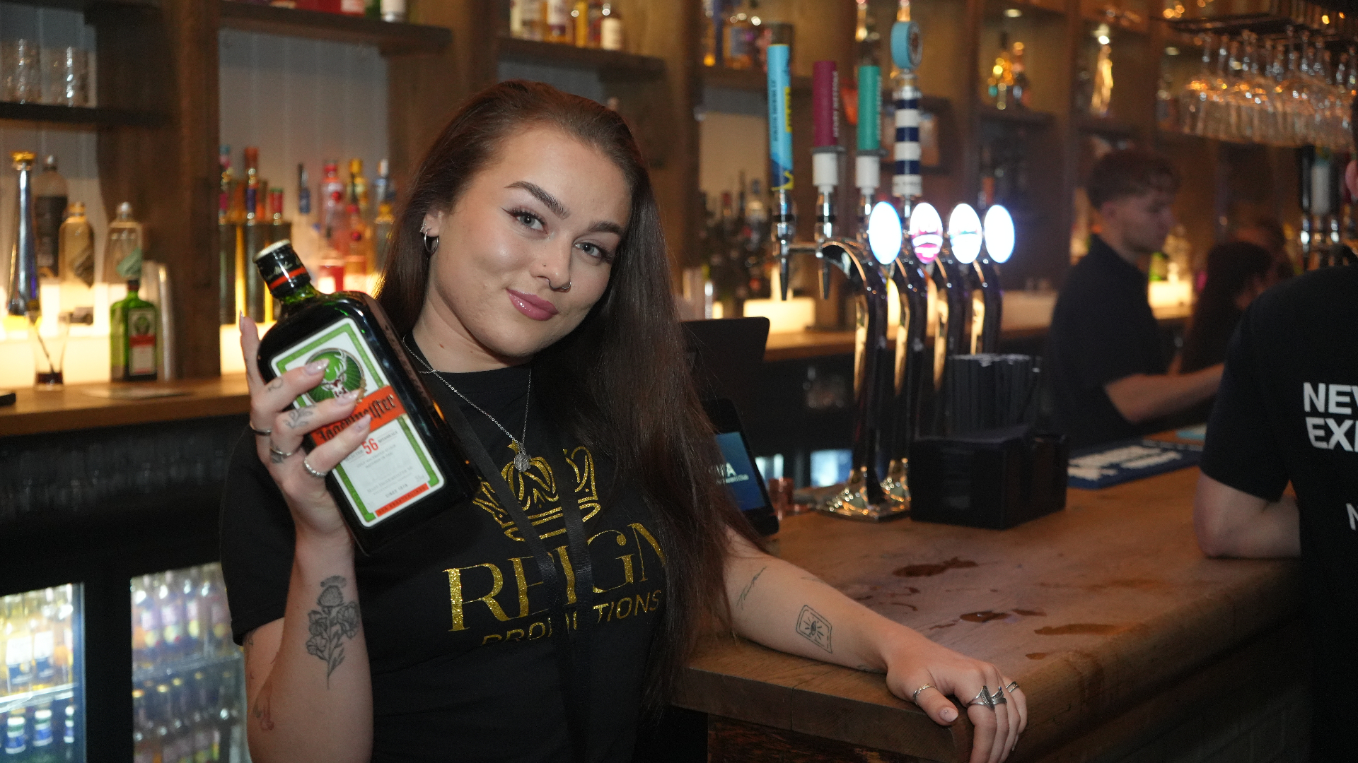Reign Promotions shot seller with Jägermeister at the bar