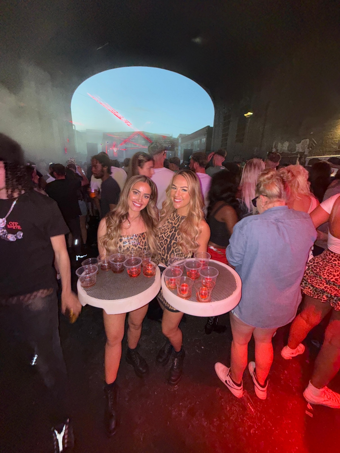 Reign shot sellers in leopard print at a warehouse event