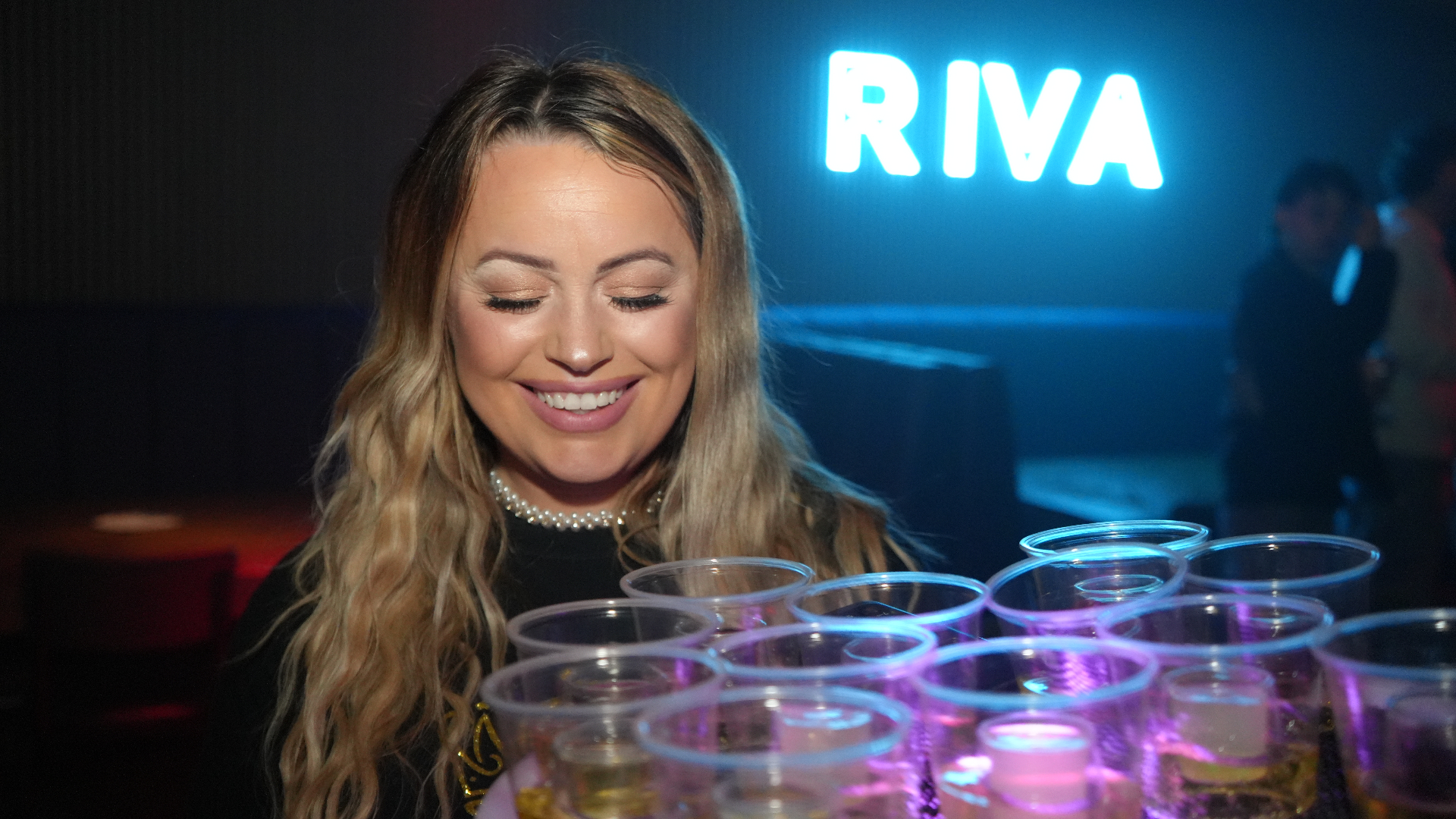 Reign shot seller with tray at Riva